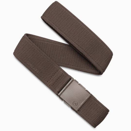 The Atlas by Arcade Belts is a brown fabric belt with a rectangular metal buckle, shown laid out on a white background and partially looped over itself.