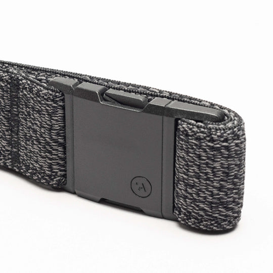 A close-up of the black and gray Atlas Low Profile Belt by Arcade Belts with a rectangular plastic buckle, displayed on a white background—ideal for travel belt enthusiasts.