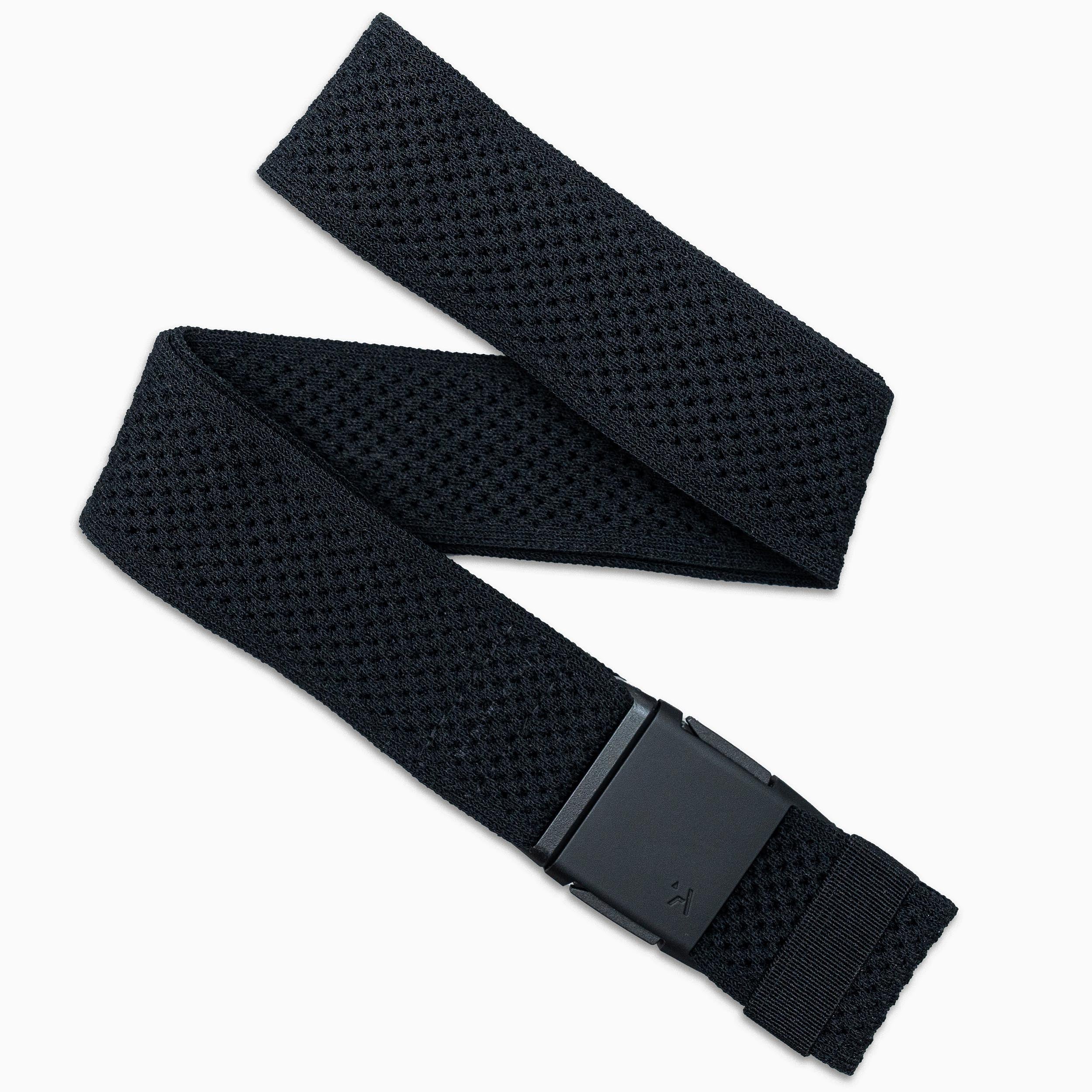 The Arcade Belts Momentum is a black woven fabric belt with a rectangular black buckle, adjustable stretch webbing, and a perforated textured pattern for comfort and style, shown laid out on a white background.