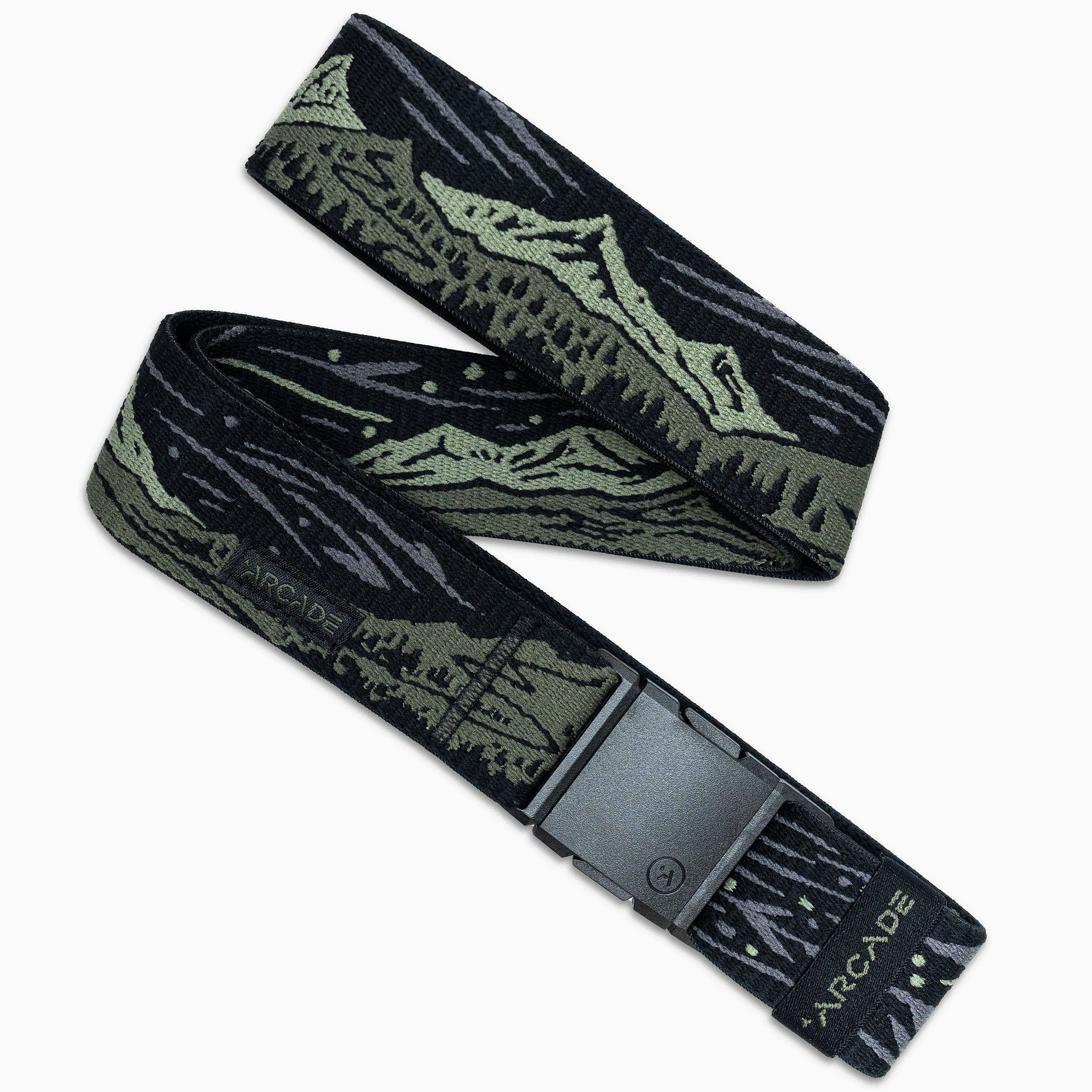 The Out of Range belt by Arcade Belts is black and olive green with a mountain landscape design, a black rectangular buckle, and "ARCADE" printed near the end of the elastic stretch fabric.